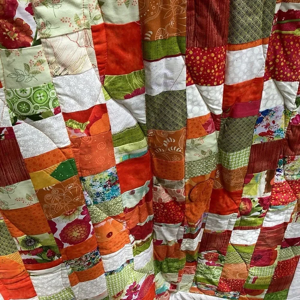 New With Tags.  Bright Summer Orange and Green Garden Coin Lap Quilt